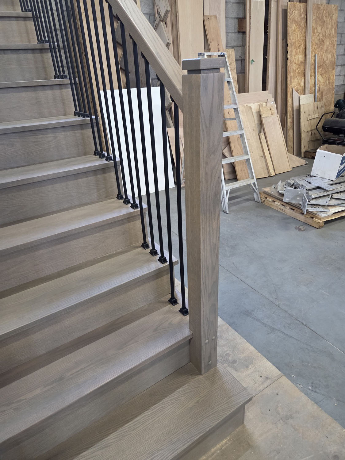 Stair system with installed treads and railings during construction