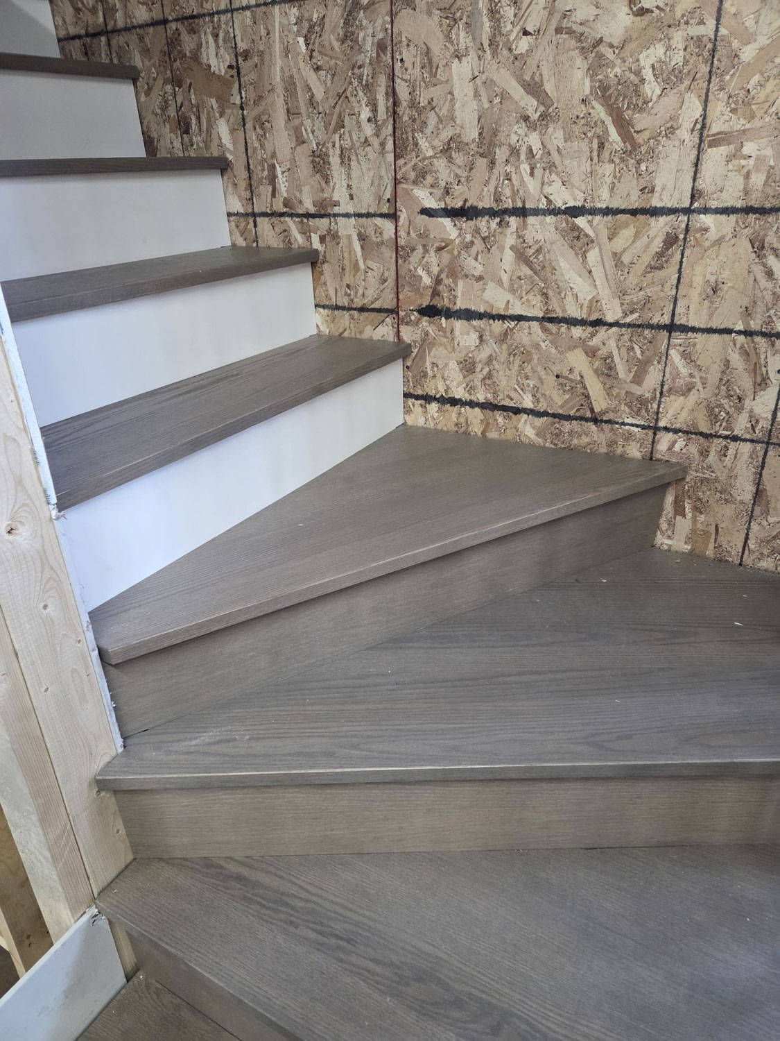 Stair treads and wall interface during installation
