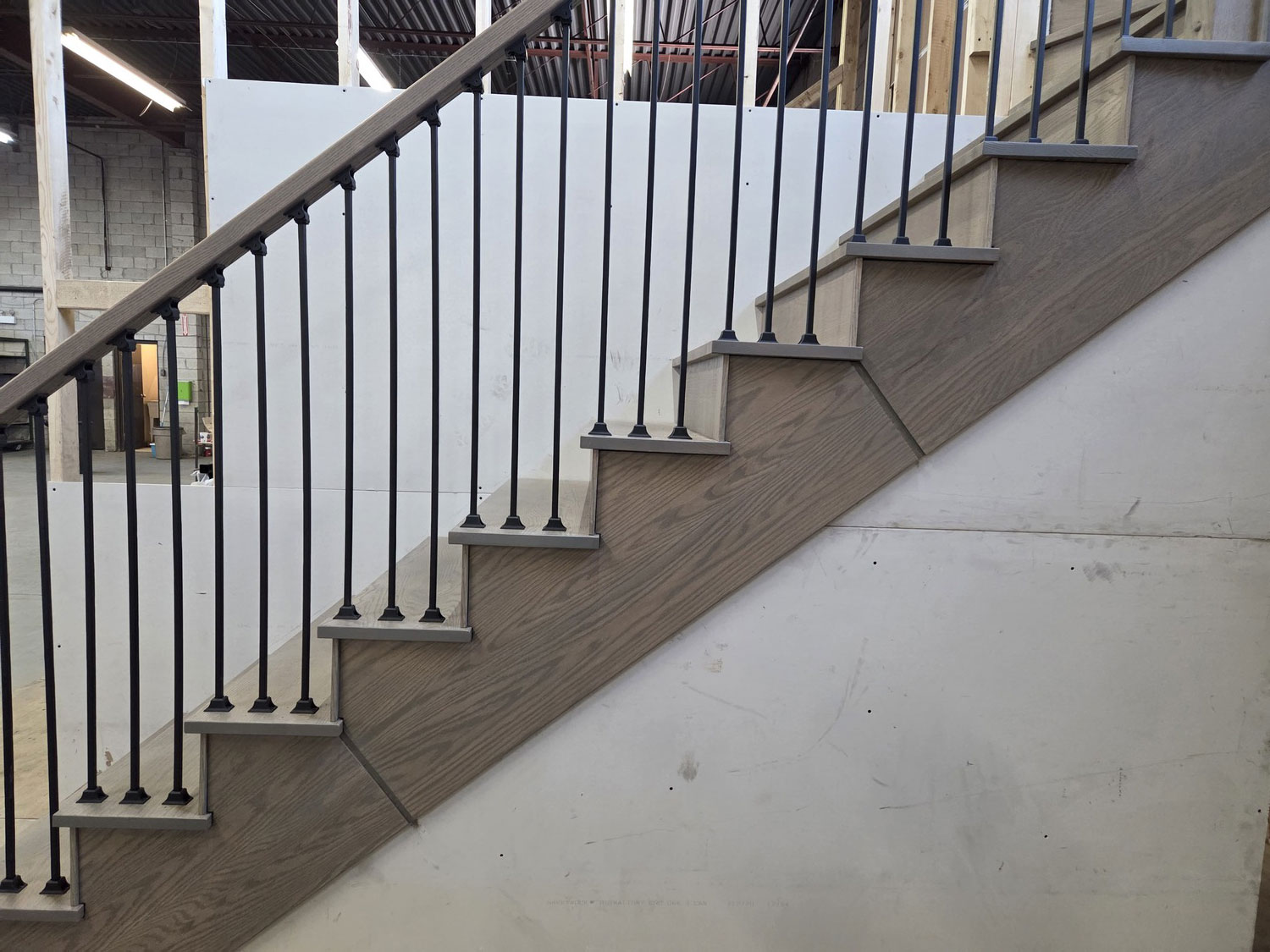 Staircase guard and landing installed during construction